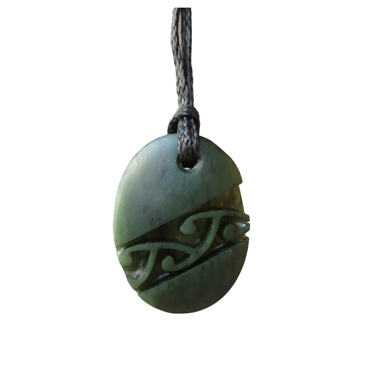 Oval greenstone pendant with diagonal pattern